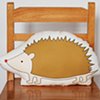 printed hedgehog pillow in brown