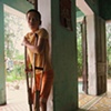 A young girl rest on her crutches, Danang