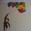 Curious George with balloons in child's bedroom.