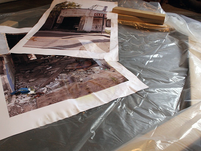sculpture of photograph in artificial puddle with fake 2x4s by Rena Leinberger at Smack Mellon