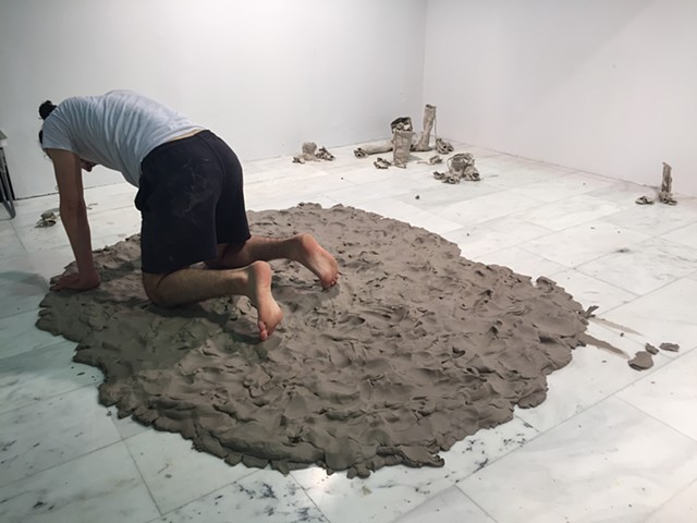 A dancer attempts to reach the height of the three dancers on a plinth of wet clay (re-performing a photograph I found when I was 28 of the 1928 production of Ode)