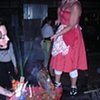 Emma Salamon serving backed beans cooked with glass ladle