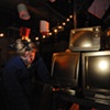Sara Gilbert with the gold TVs