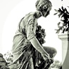 Kneeling statue with Flowers