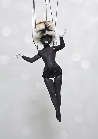 photograph of black doll with cotton hair by christopher andres