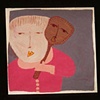 Primitve Toy Held by Boy in Pink Shirt