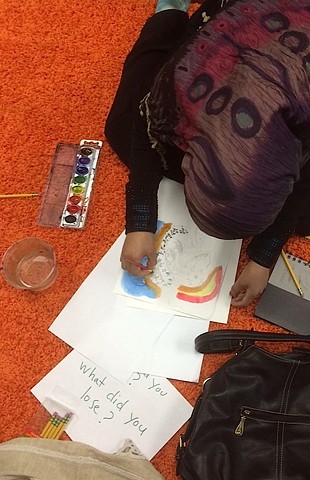 Art workshop at the community center to paint responses to "What have you lost? What have you gained, in immigrating?"