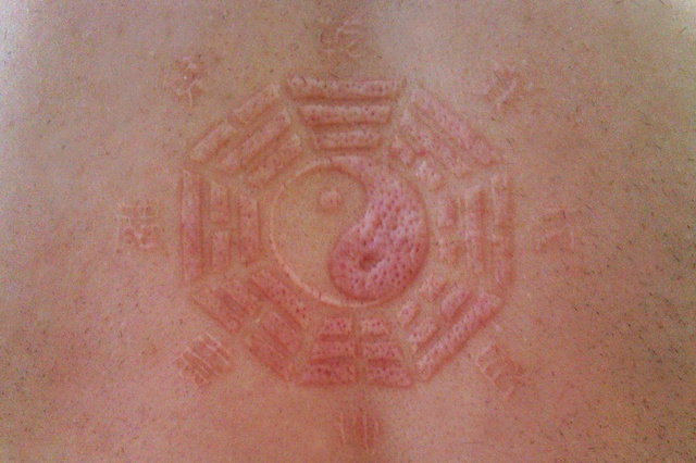 Yang Yang and Trigrams scarification