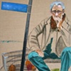 "Man pondering on Magazine"