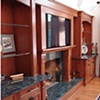 Side view, full wall built-in entertainment unit and fire surround. 