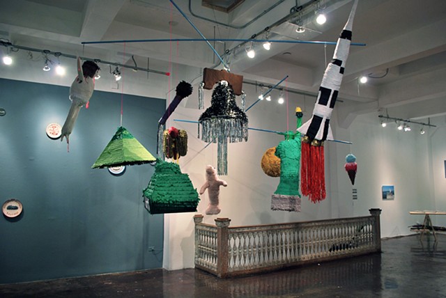 Piñata Mobile
2012
Paper materials, wheat paste, dum-dums, mylar, string, cables, steel, and mixed media.