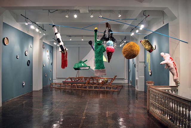 Piñata Mobile
2012
Paper materials, wheat paste, dum-dums, mylar, string, cables, steel, and mixed media.