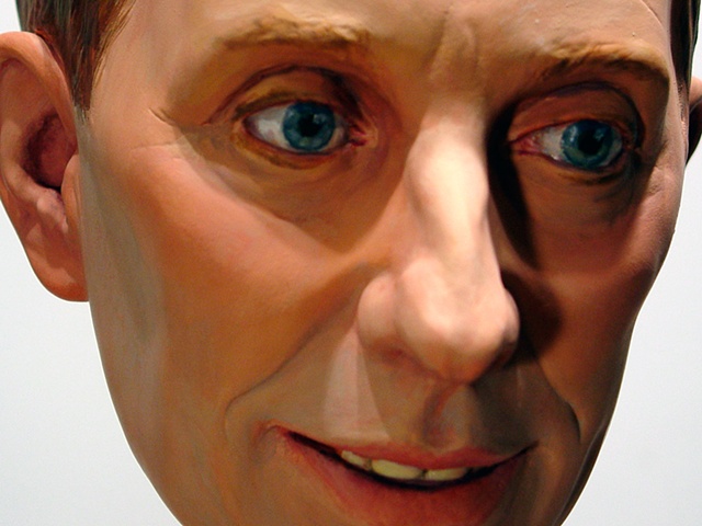 polychrome figurative portrait head of ArtForum's Knight Landesman
