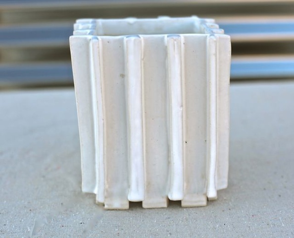 Medium extrusions, gloss white glaze.    
