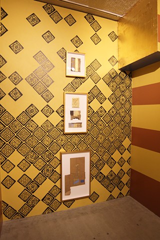 View of back wall with four corners of Mayan world motif and gilded soffit