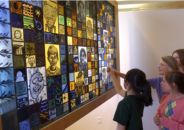 Stamford Elementary School Vermont. Stained glass residency with Debora Coombs, Kidspace at MASS MoCA. Stained glass quilt, mosaic. Children's painting on stained glass. self-portraits, aliens, monsters, symbols.