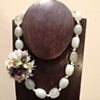 prehnite, pearls, silver jinglies, and silk flower