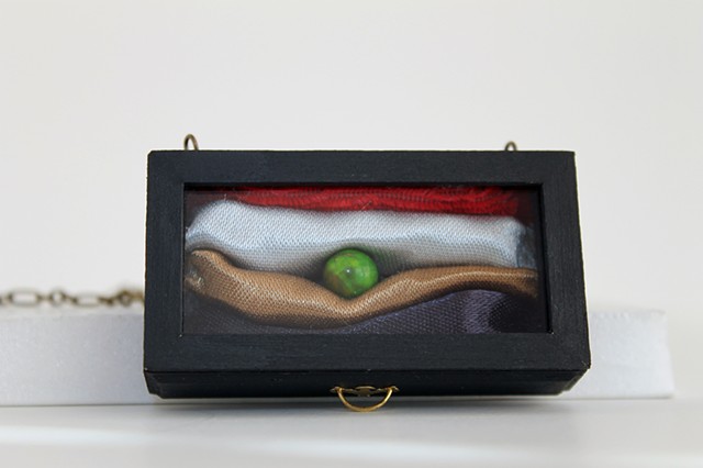 Princess on the Pea (miniature)
2014
Vintage dollhouse drawer, microscope lens, acrylic, trim, brocade, jasper
2 3/8" x 1 1/2" x 5/8"