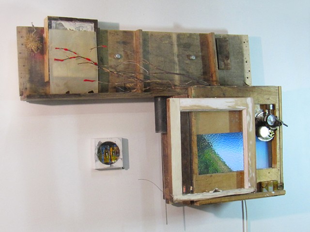 "MultiTell-a-Visions" sculpture of wood and digital animations by Water Kerner