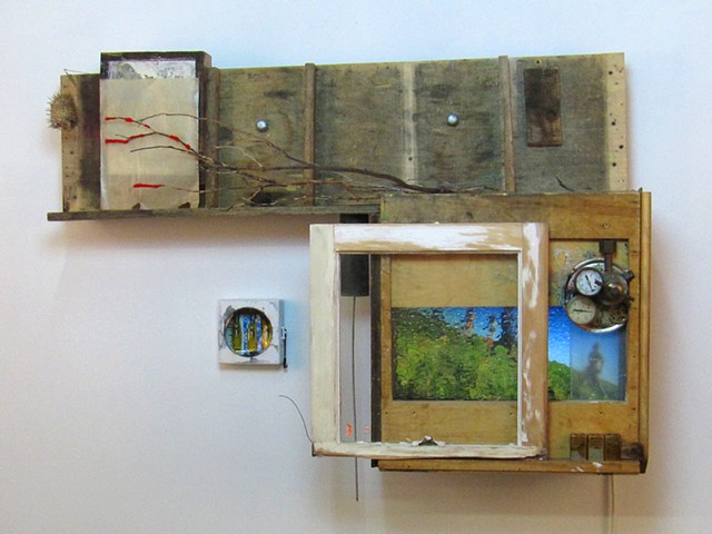 "MultiTell-a-Visions" sculpture of wood and digital animations by Water Kerner