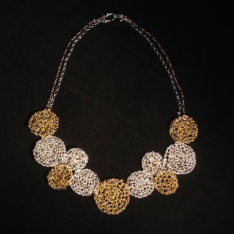 Hand crocheted sterling silver plated and nu gold wire; embellished with hematite delicas and a smokey topaz bead. Sterling silver and gold filled chain, and sterling clasp.