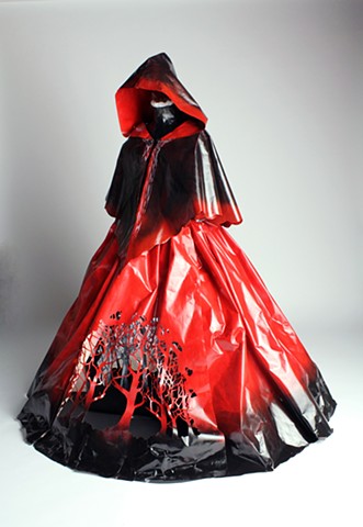 A life- size paper gown sculpture referencing themes of guilt and anger. Art inspired in part by fairytales and historical costume. Paper Dress by artist Emily Chase