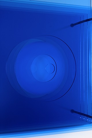 Blue geometric abstraction based on number sequence in laser-cut acrylic.