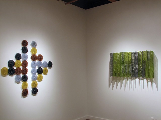 Minimal geometric crocheted fiberglass and polyester resin wall sculpture based on Grid Pi and Pascal's Triangle by Yvette Kaiser Smith