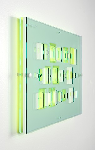 Green, blue, and white laser-cut acrylic template grid installation based on pi by Yvette Kaiser Smith