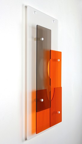Geometric abstraction in laser-cut acrylic, white, brown, and orange.