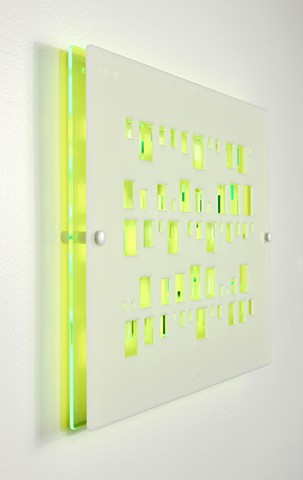 Green and white laser-cut acrylic template with geometric pattern based on pi by Yvette Kaiser Smith