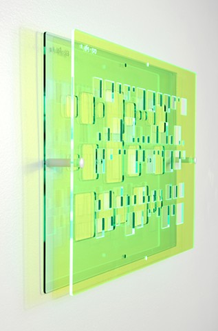 Green and blue laser-cut acrylic template with geometric pattern based on pi by Yvette Kaiser Smith