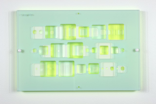 Green, white, and blue laser-cut acrylic template with geometric pattern based on pi by Yvette Kaiser Smith