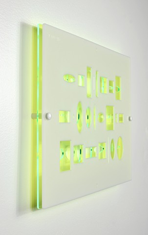 Green and white laser-cut acrylic template with geometric pattern based on pi by Yvette Kaiser Smith