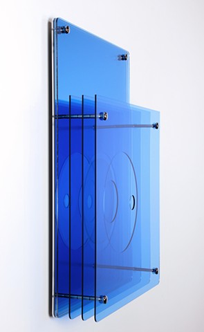 Blue geometric abstraction based on number sequence in laser-cut acrylic.
