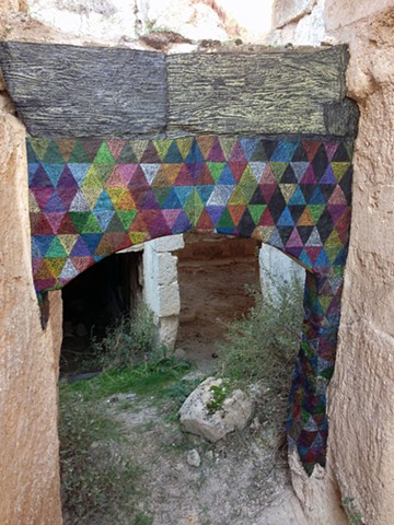 Temporary installation, paper on stone, Cappadocia, Turkey by Carmi Weingrod