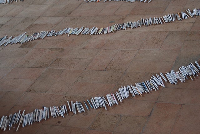 Exhibition Flying Carpet Prayers at El P�sito
On the floor, rolled newspaper from Catalunya in the shape of Ca�adas Real
