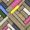 Untitled (raw linen, various weight, rolled, dipped in multi-colored paint)