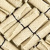 Untitled (Rolled natural canvas, bound with black thread)
