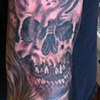 Black and grey skull and smoke on Metal Bobby